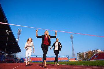 Image showing business people running on racing track