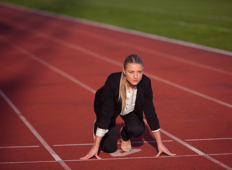 Image showing business woman ready to sprint