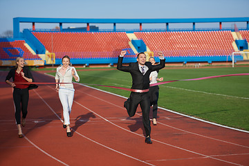 Image showing business people running on racing track