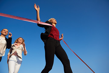 Image showing business people running on racing track