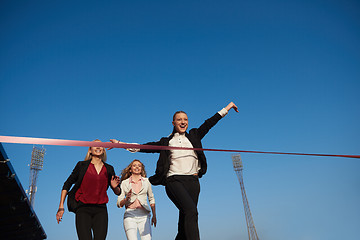 Image showing business people running on racing track