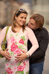 Image showing young pregnant couple have fun and relax