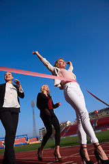 Image showing business people running on racing track