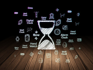 Image showing Time concept: Hourglass in grunge dark room