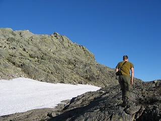 Image showing Photographer tracking in mountains.