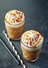 Image showing two glasses of caramel latte with whipped cream