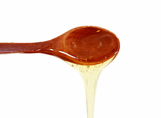 Image showing Wooden spoon with honey 