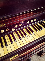 Image showing Antique reed organ keyboard and stops