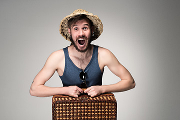 Image showing Young, attractive man  in sunglasses with  suitcase ready to travel 