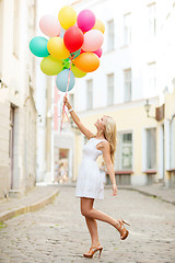 Image showing woman with colorful balloons