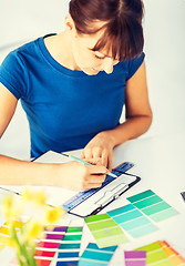 Image showing woman working with color samples for selection