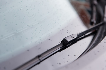 Image showing close up of windshield wiper and wet car glass