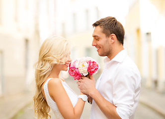 Image showing couple with flowers in the city