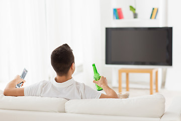 Image showing man watching tv and drinking beer at home