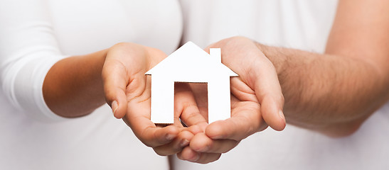 Image showing couple hands with paper house