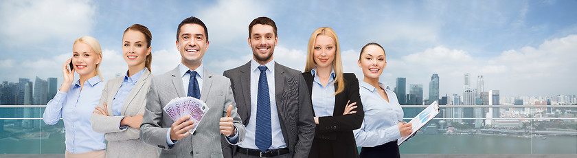 Image showing smiling businessman with american dollar money