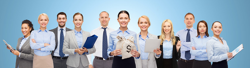 Image showing group of happy businesspeople with money bags