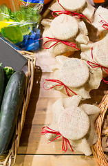 Image showing honey decorated jars and vegetables at food market