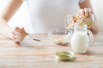 Image showing close up of woman eating muesli for breakfast