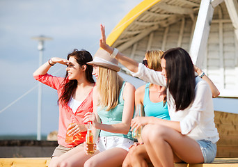 Image showing girls with drinks on the beach