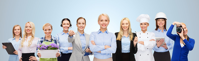 Image showing happy businesswoman over professional workers