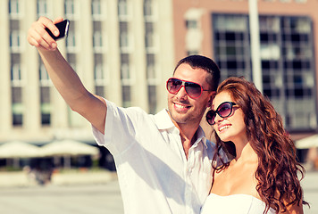 Image showing smiling couple in city