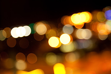 Image showing golden bright lights on dark night background