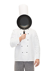 Image showing male chef cook covering face with frying pan