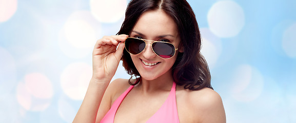 Image showing happy woman in sunglasses and swimsuit