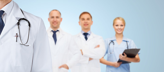 Image showing group of happy medics in white coats