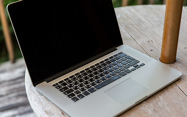 Image showing close up of laptop computer on table at hotel