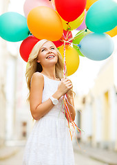 Image showing woman with colorful balloons