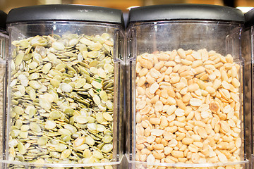 Image showing jars of peanuts and pumpkin seeds at grocery store
