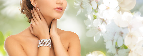 Image showing beautiful woman with pearl earrings and bracelet