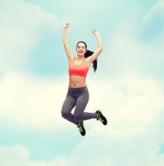 Image showing sporty teenage girl jumping in sportswear