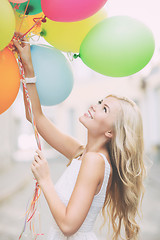 Image showing woman with colorful balloons