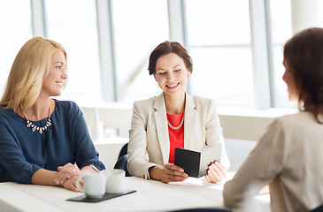 Image showing happy women looking at restaurant bill