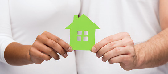 Image showing couple hands holding green house