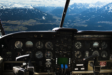 Image showing dashboard in airplane cockpit and mountains view