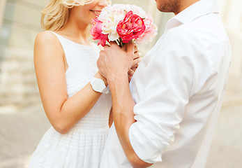 Image showing couple with flowers in the city