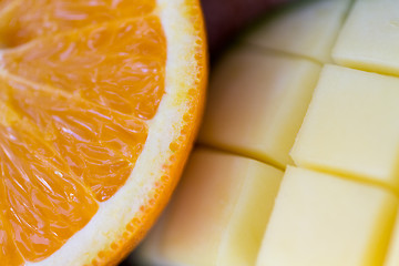 Image showing close up of fresh juicy orange and mango slices
