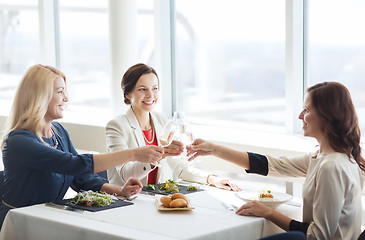 Image showing happy women drinking champagne at restaurant