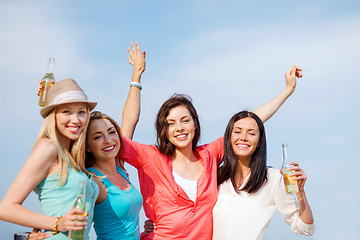 Image showing girls with drinks on the beach