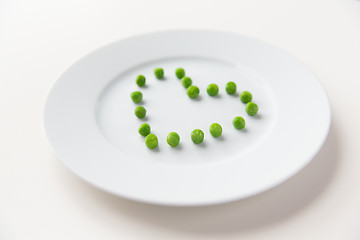 Image showing close up of plate with peas in heart shape 