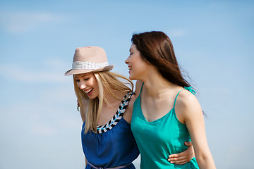 Image showing girls walking on the beach