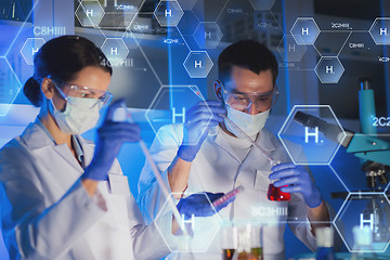 Image showing close up of scientists making test in lab