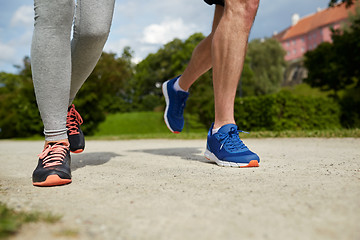 Image showing close up of couple running outdoors