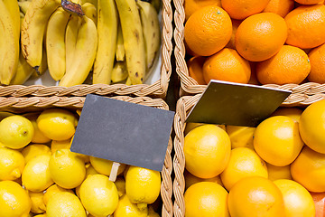 Image showing fruits in baskets with nameplates at food market