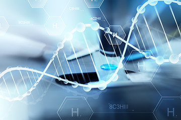 Image showing close up of scientist hand with test sample in lab