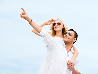 Image showing couple in shades at sea side